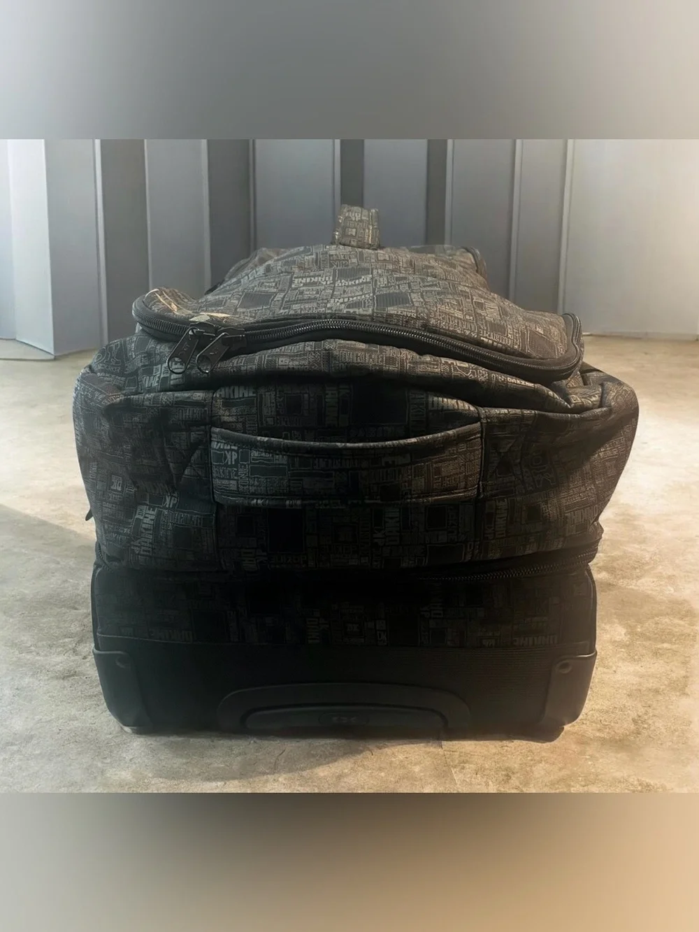 Dakine Split Roller 110L Wet Dry Duffel with a distinctive geometric pattern.